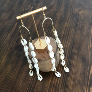 Cowrie Shell arch earrings by Crowned by Jelani