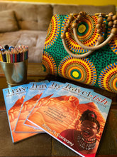 Load image into Gallery viewer, photo of a relaxing scene of the Travelish coloring book and a jar of sharpened coloring pencils on a table with a beautiful African print purse
